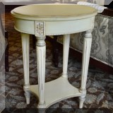 F08. Oval painted side table. 25”h x 14”w x 19”d 